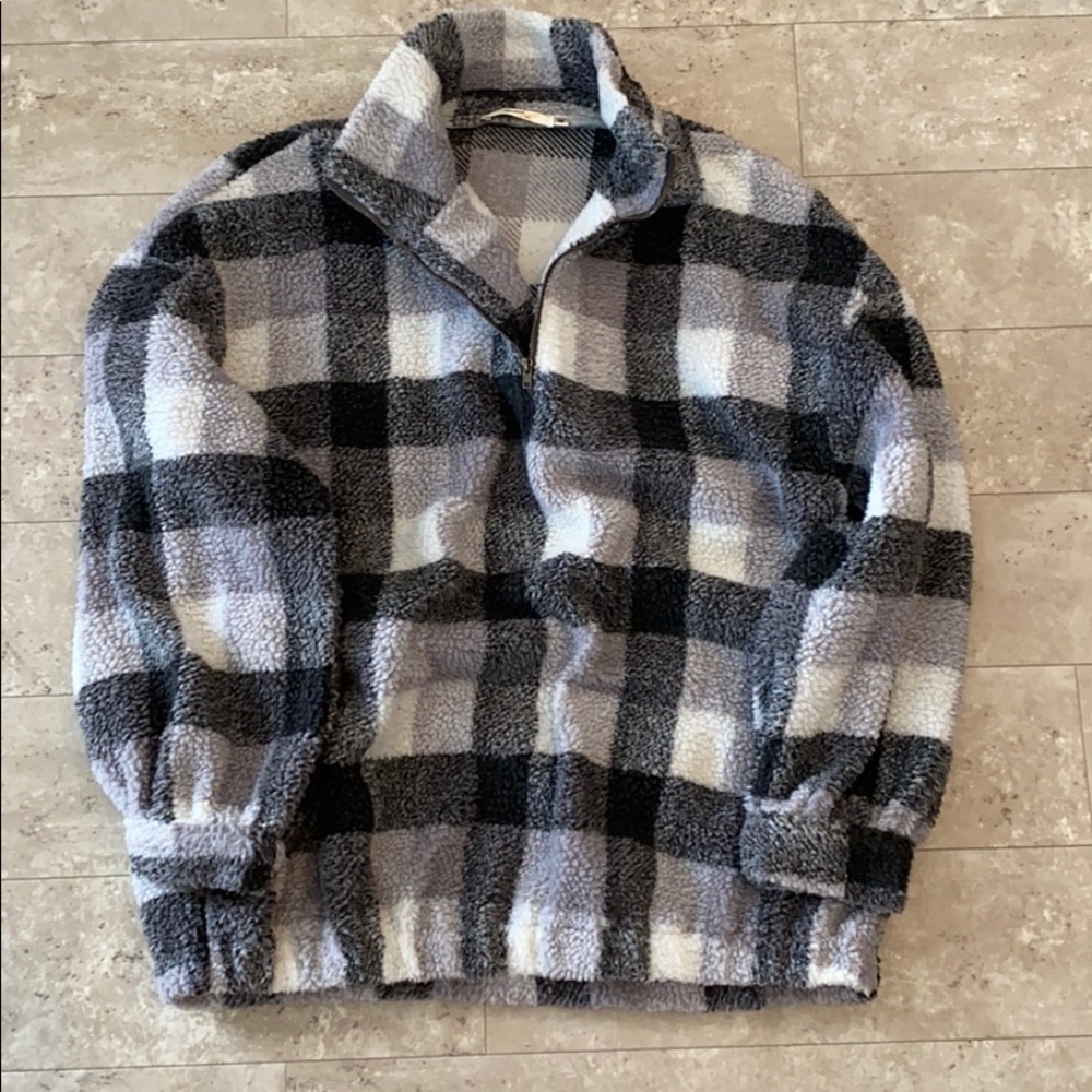 black and white checkered 1/4 zip fleece pullover.